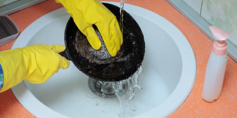 how to strip seasoning off cast iron